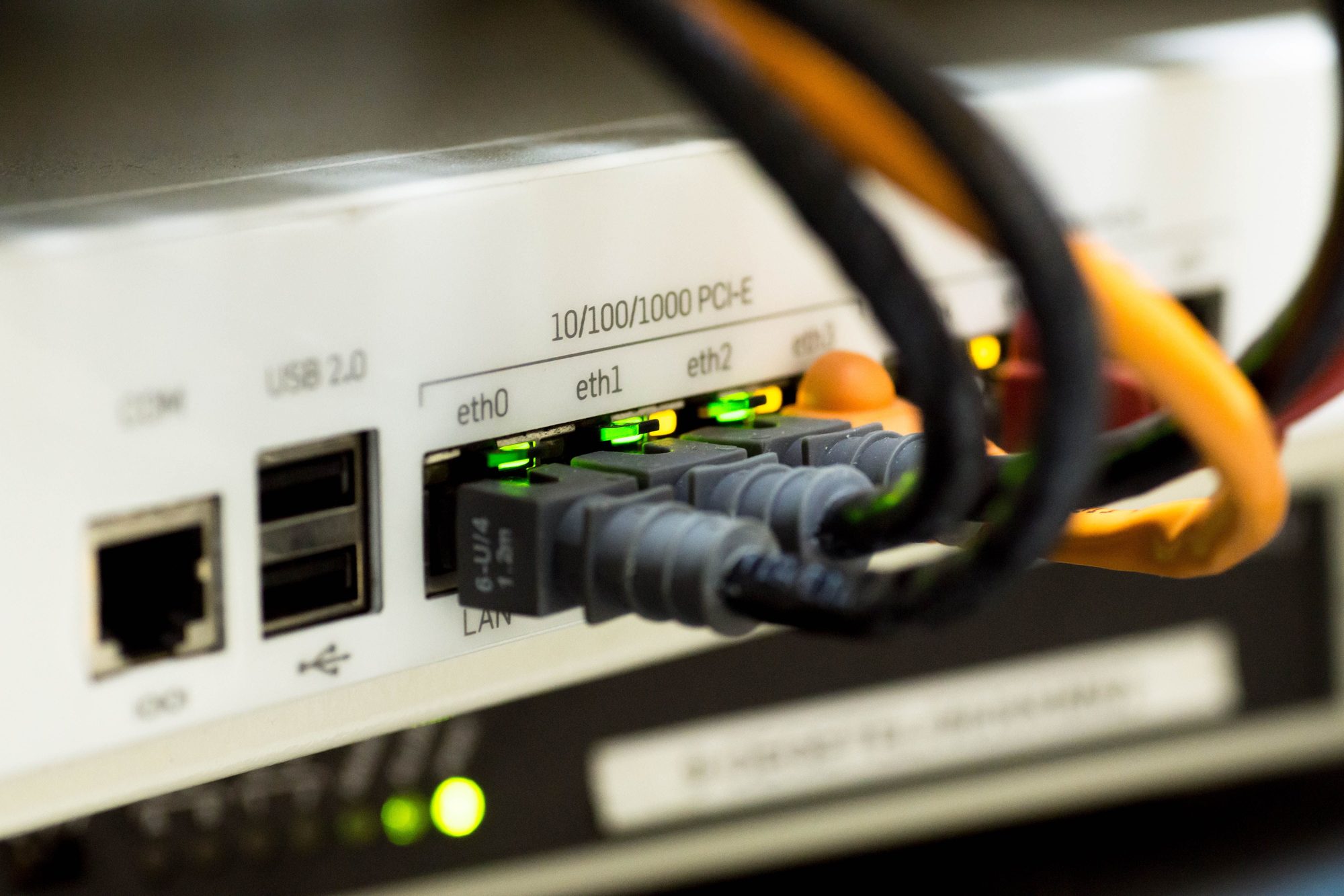 Ethernet and fiber cables connected to a rack-mounted network switch